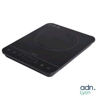 a close up of a black induction cooktop on a white background