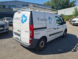 a white van that is parked in a parking lot