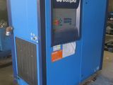 a close up of a blue machine in a warehouse with other machines