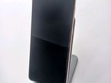 a cell phone that is sitting on top of a stand