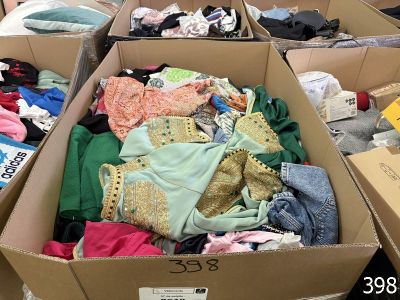 many boxes of clothes that are sitting on the floor