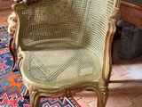 a chair that is sitting on a rug in a room
