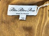 a close up of a label on a brown dress