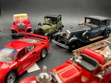a lot of toy cars that are sitting on a table