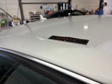 a sticker on the hood of a car