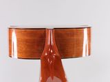 a wooden table with a guitar on top of it