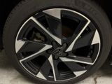 a close up of a tire on a black car