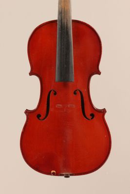 an old violin with a bow hanging from it ' s back