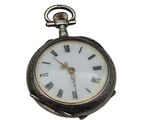a silver pocket watch with roman numerals on it