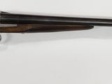 a close up of a rifle mounted on a wall