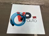 a close up of a sign with a blue hose attached to it