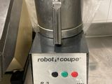 a blender that is sitting on a counter in a kitchen