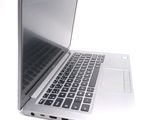 a close up of a laptop computer on a white surface