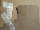 a piece of tape taped to the side of a cardboard box