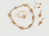 a collection of gold jewellery including a bracelet, ring, and earrings