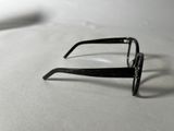 a pair of glasses sitting on a white surface