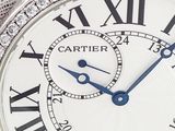 a close up of a wrist watch with diamonds on it