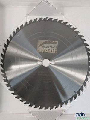 a circular saw blade that is on the wall