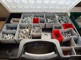 a tool box with many different types of screws in it