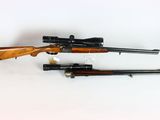two rifles are shown on a white surface, one is a rifle and the other is a rifle