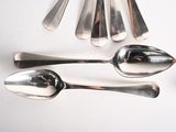 a lot of spoons and spoon spoons on the table