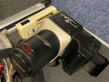 a camera that is sitting in a case on the floor