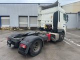 a white truck that is parked in a parking lot