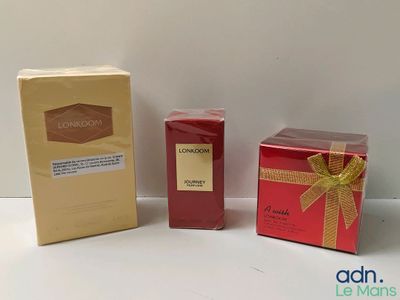 two boxes of perfume and a box of soap on a white surface