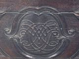 a wooden box that has a decorative design on it