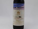 a bottle of wine that is sitting on a table