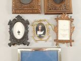 a picture of a collection of framed pictures on a wall
