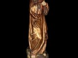 a statue of a woman holding a bird in her hand