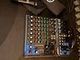 two microphones and a mixer sitting on a table