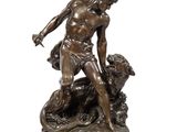 statue en bronze représentant un homme avec un chien sur un rocher