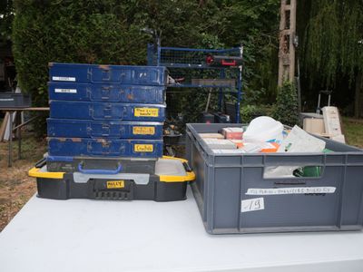 many boxes that are sitting on a table in the yard