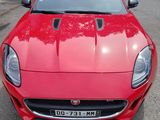 a red sports car parked in a parking lot