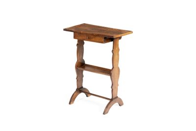 a small wooden table with a shelf on it