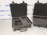 two open cases sitting side by side on a white surface