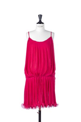 the pink dress is on a mannequin stand on a white background