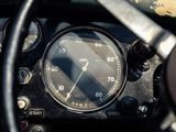 a close up of a dashboard with a speedometer and gauge