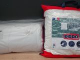 two bags of pillows and a bag of pillows on a shelf