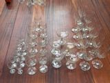 a lot of empty wine glasses on the floor