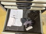 a drawer with a glove and a pair of gloves in it