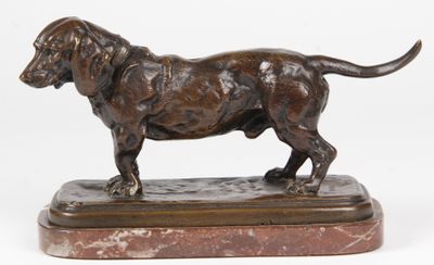 bronze statue of a dog on a marble base on a white background
