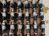 a lot of different types of valves on the floor