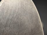 close up of a person holding a knife in their hand