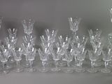 a lot of wine glasses that are sitting on a table