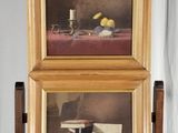 tableau représentant une nature morte avec des fruits et une bougie posée sur un chevalet