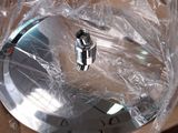 a large metal object wrapped in plastic on top of a table