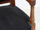 a black chair with a black cushion on it
